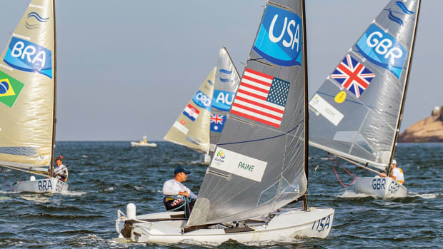 Paine heads upwind under the watchful eyes of gold-medal winner Giles Scott of Great Britain