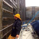 Captain Sue Kelly negotiating lines for a lock passage in inclimate weather