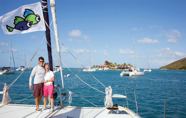 Jason and Gail after arriving in the BVI, with their flag flying proudly