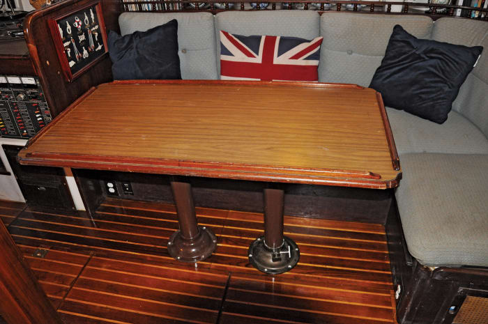 The original saloon table as seen from the starboard-side settee: large but impractical