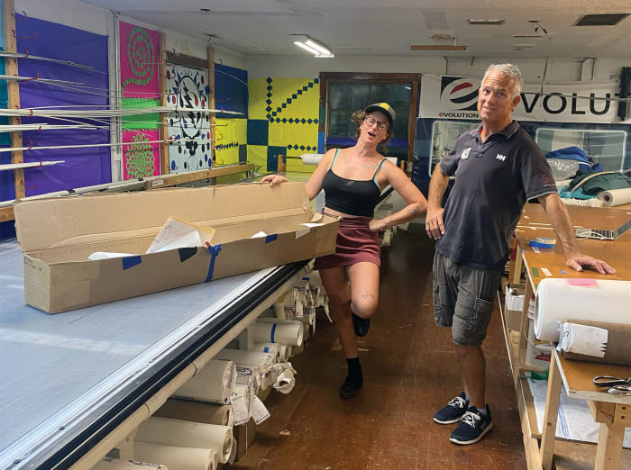  Emily and loft owner and founder Jerry Latell with the box containing the panels that would become her new triradial headsail.