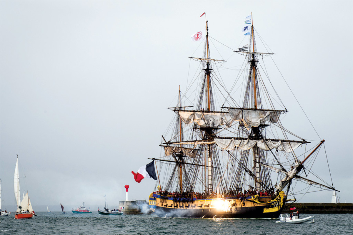L’Hermione’s cannon sound off as she enters the harbor.