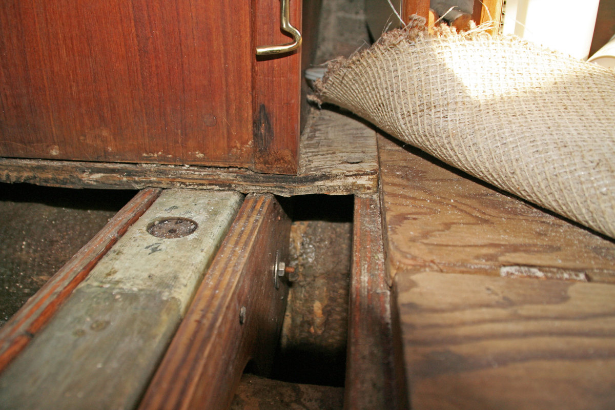 Here you can see the water-damaged floor under the compression post
