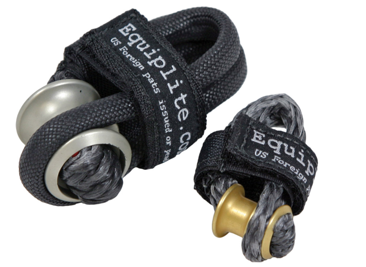 These Equiplite items are about as high-tech as soft shackles get. The end of the halyard is spliced to the aluminum bobbin, and the soft part of the shackle is passed through the sail’s head and secured with the Velcro strap