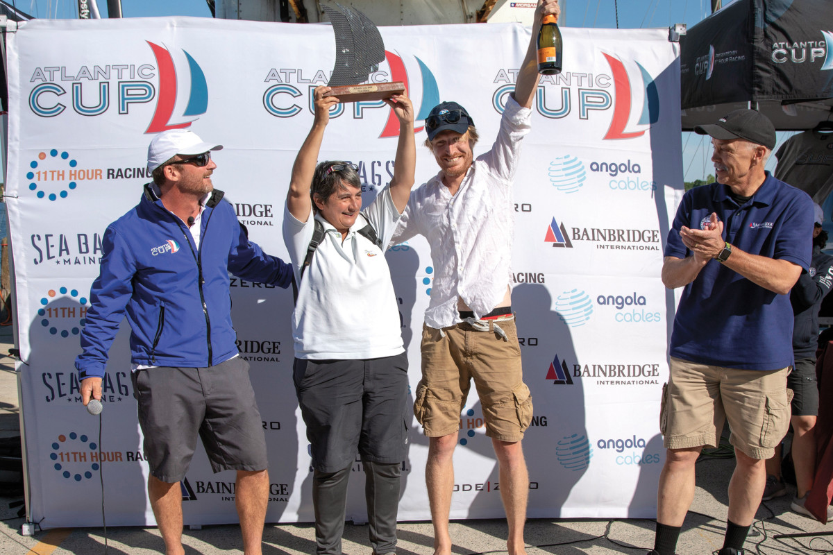 Pourre (left) and Luciani celebrate their overall win back on shore in Portland   