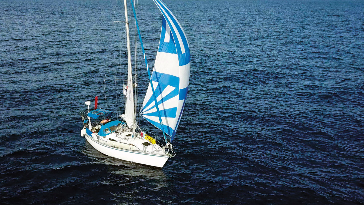 Sea Casa sails under spinnaker, en route to the Marquesas