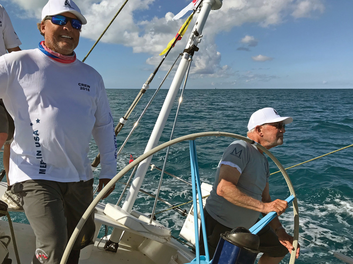 Chip (left) with his father, Bill, at the wheel, close in on the finish in Bermuda