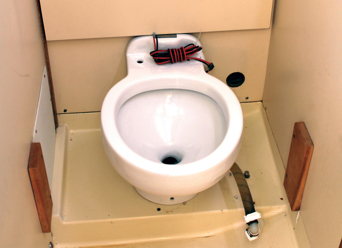 Dry-fit the toilet first to get an idea of hose and electrical cable runs