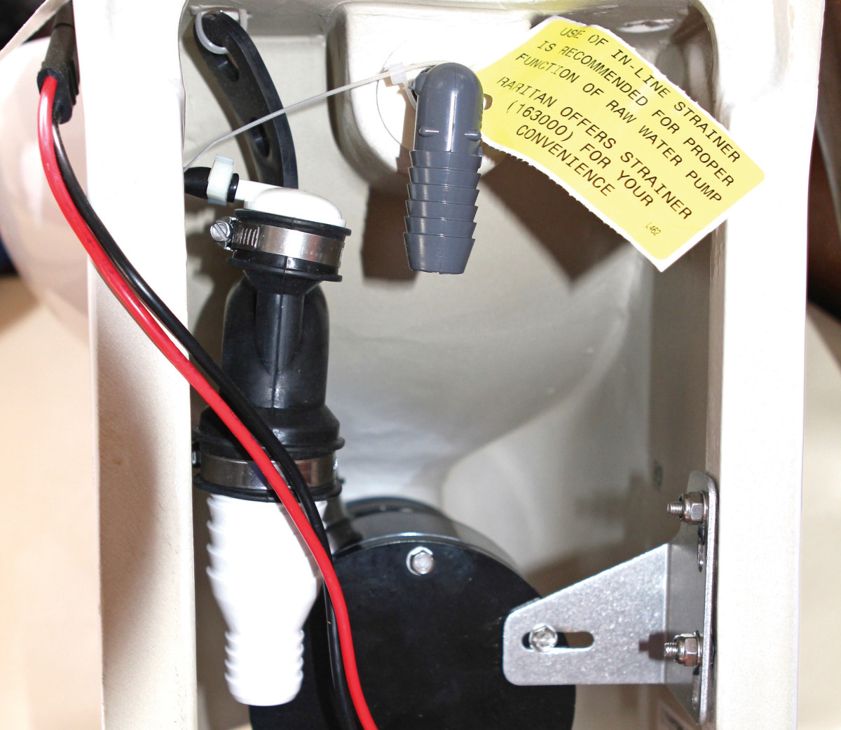 The guts of the toilet were simple enough, with the macerator pump under the bowl