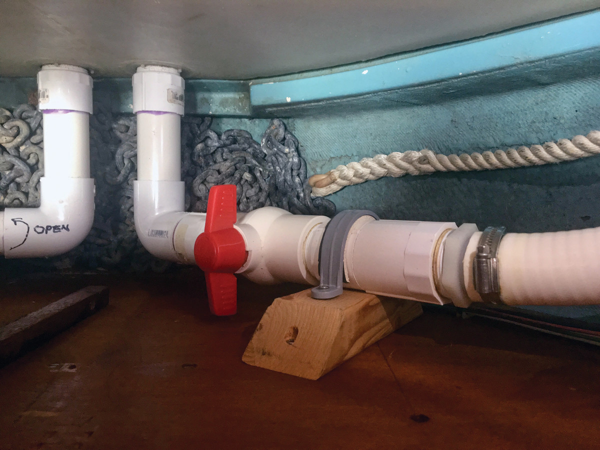 One of two PVC ball valves plumbed into the tank exit points