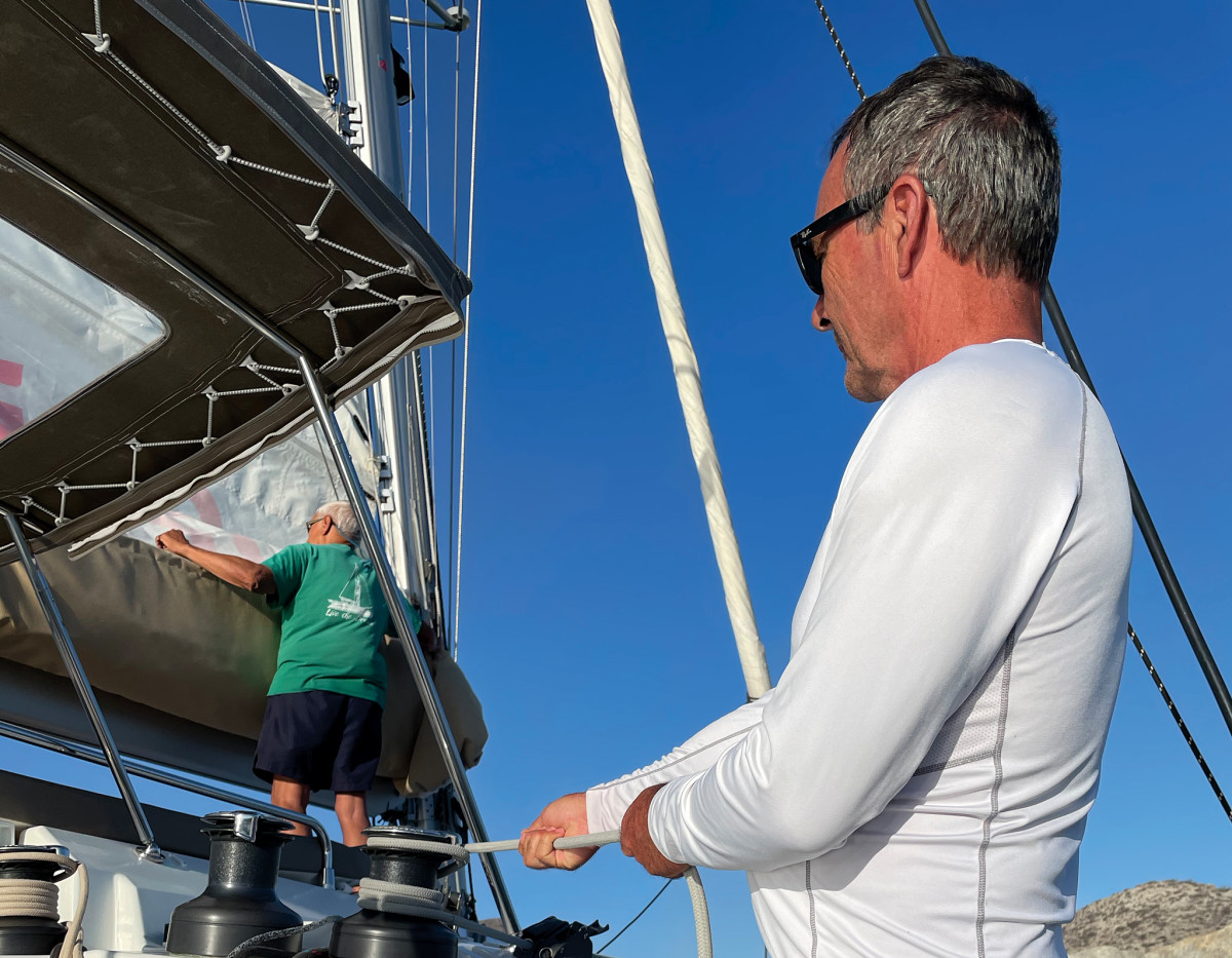 The mainsail can be a challenge to raise aboard some bigger cruising catamarans