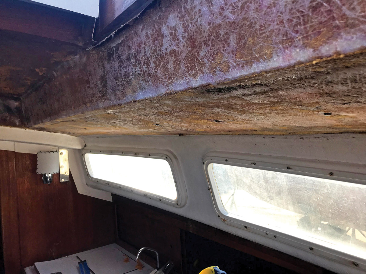 The bare fiberglass underside of the cabintop after scraping and sanding