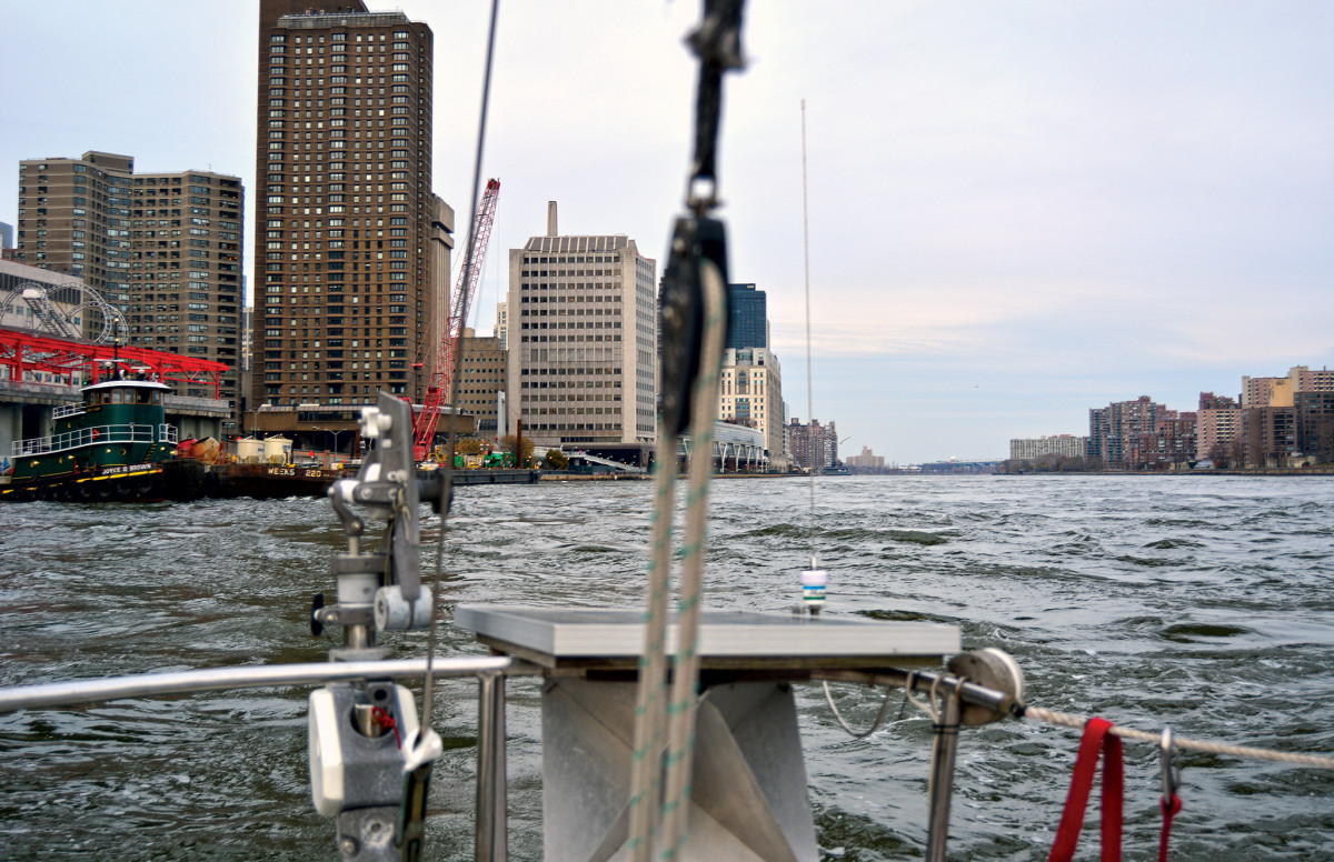 Looking astern at the swirling waters of New York’s East River