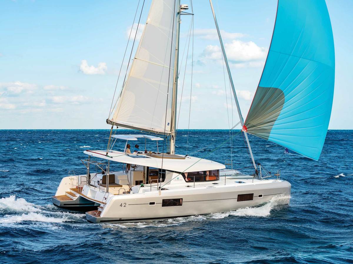 The Lagoon 42 incorporates a number of today’s design features, like chines, tumblehome bows and an elevated lounge area; the mast is also set well aft to make the rig easier to handle