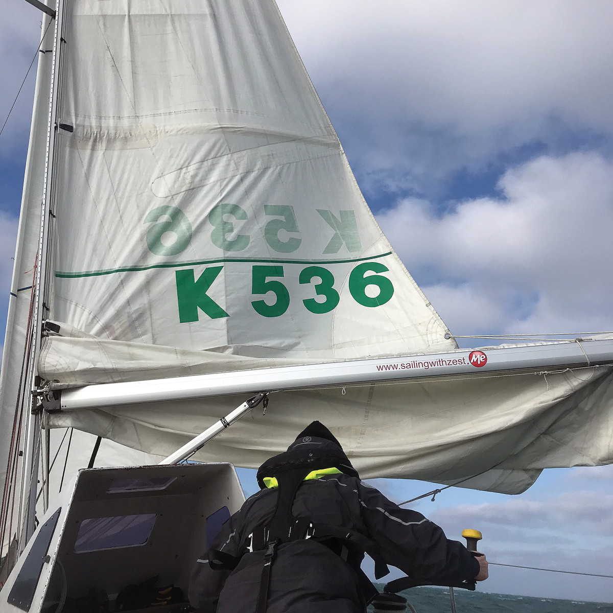 It may not be pretty, but reefing while sailing downwind means not having to fight a spike in the apparent wind