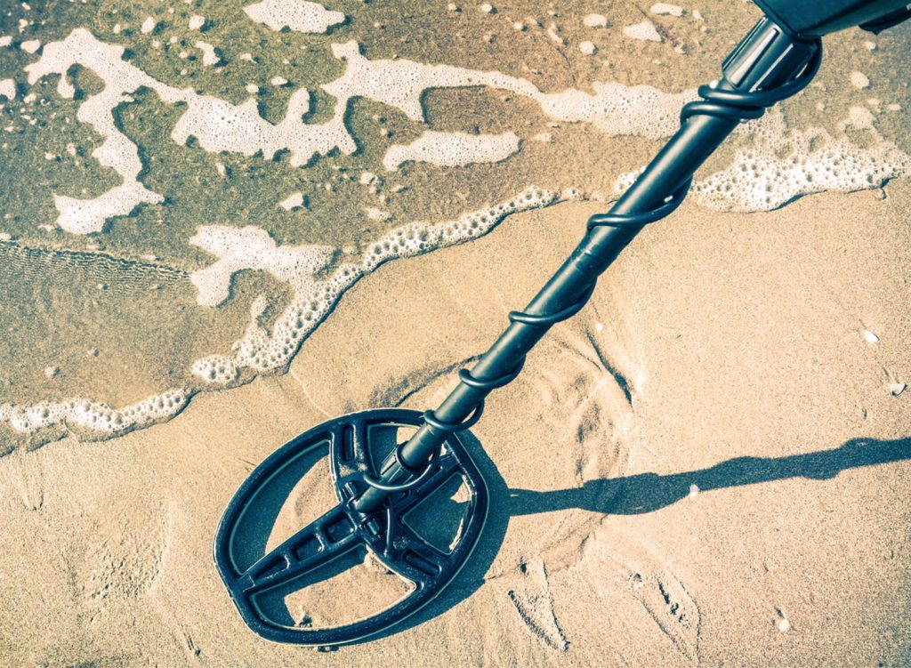 Metal detecting on a beach