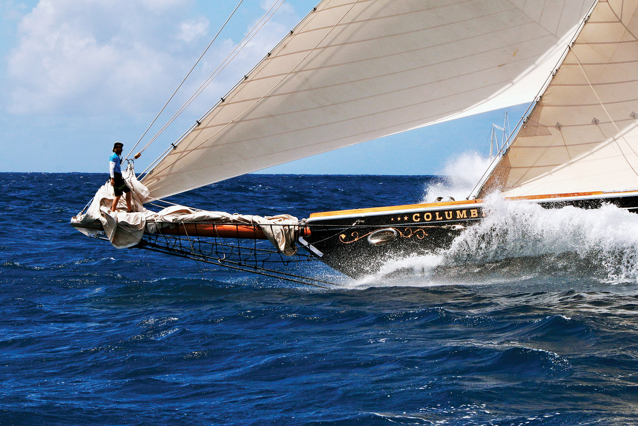 The bowman aboard Columbia has the catbird seat at the Antigua Classic Yacht Regatta.